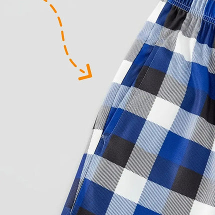 "Family Christmas 2025 Making Memories Together" Text and Santa Hat Printed Blue and White Plaid Family Matching Pajamas